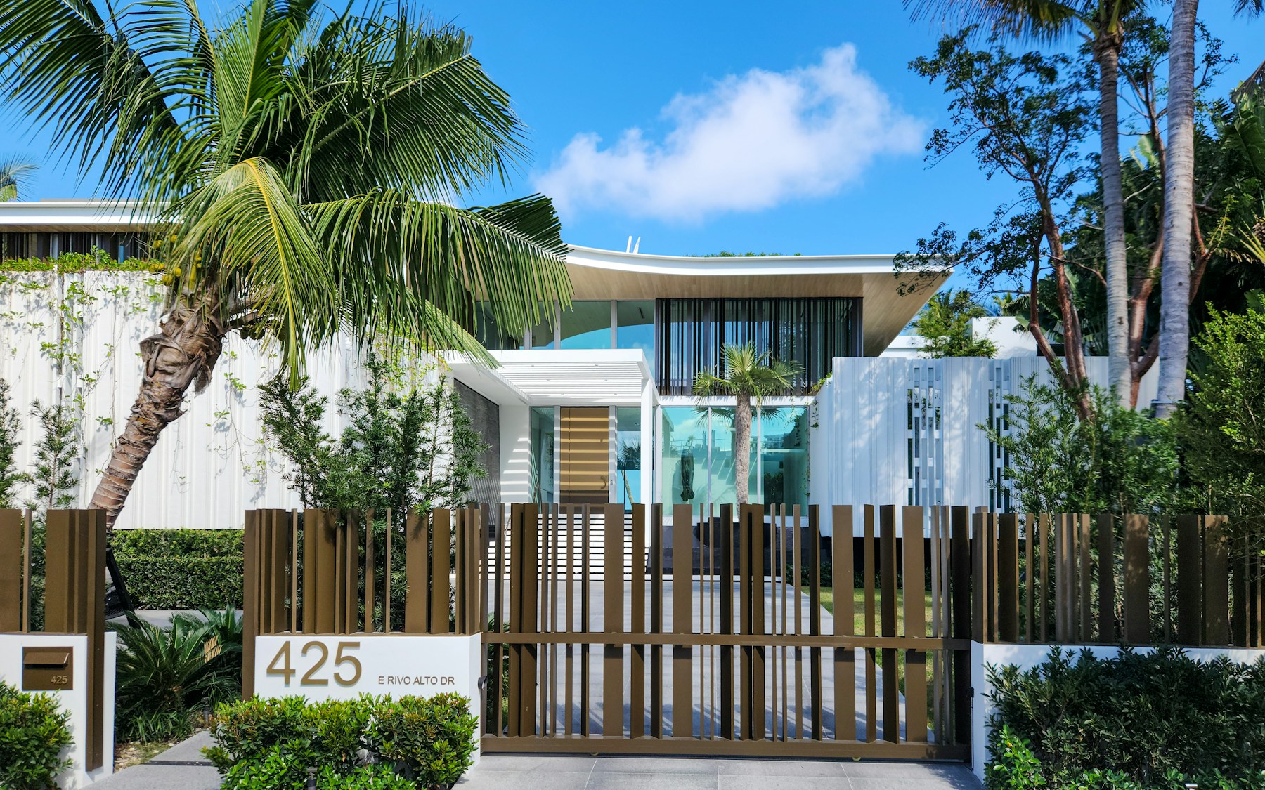Modern white residential architecture framed by palms in Miami Beach